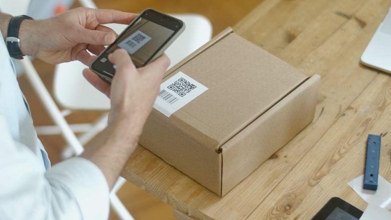 How can QR codes help small businesses revitalize their product labels design?